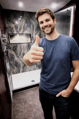 Happy client after modern bathroom renovation complete